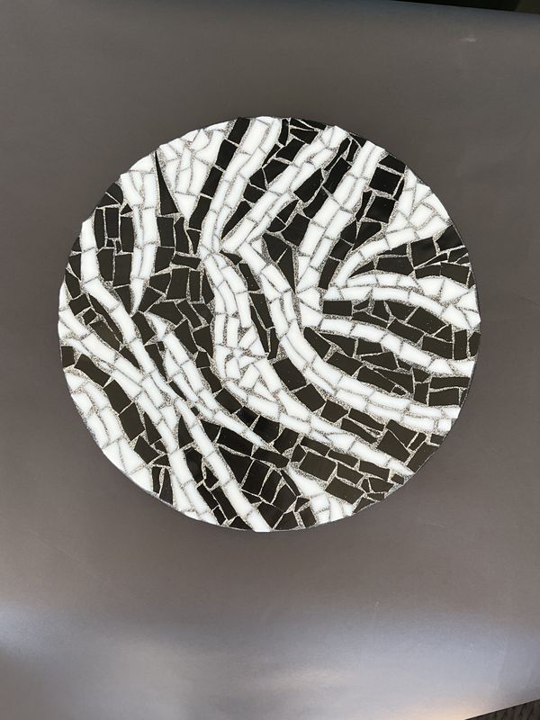 Round mosaic wall plate in a black-and-white zebra-stripe abstract pattern